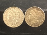 2 silver Morgan dollars, 1882-O and a 1886-P