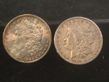 2 silver Morgan dollars, 1885-O and a 1889-P