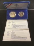 1986 U.S. mint Liberty silver dollar and half dollar set