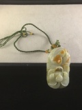 White jadeite pendant of carp fish above lotus flower blossom w/ beaded necklace