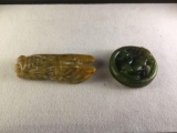 Jade pendant of a large brown cicada and a carved green prancing horse within a circle