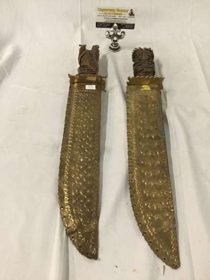 Pair of vintage Middle Eastern serpent blade knives w/ stamped metal sheaths