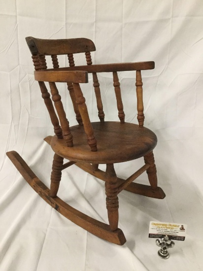 Antique wood carved child / doll size rocking chair, approx 22 x 10 x 20 inches.