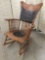 Antique wood carved rocking chair with tufted leather/vinyl seat and back