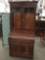 Antique English flame veneer burled wood roll top secretary desk w/ glass cabinet display top as is