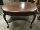 Vintage mahogany carved two tiered table with claw feet and one drawer