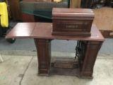 Antique wood carved The Eldridge B sewing machine work station