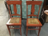 Pair of vintage wooden dining chairs with upholstered seats