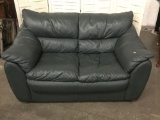 Green leather loveseat in good cond- matches 329