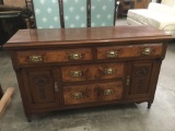 Antique burl front wood server sideboard with brass fixtures and carved door detail