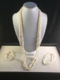 3 strand 30 inch fresh water pearl necklace and 2 matching bracelets w/ 14K clasps