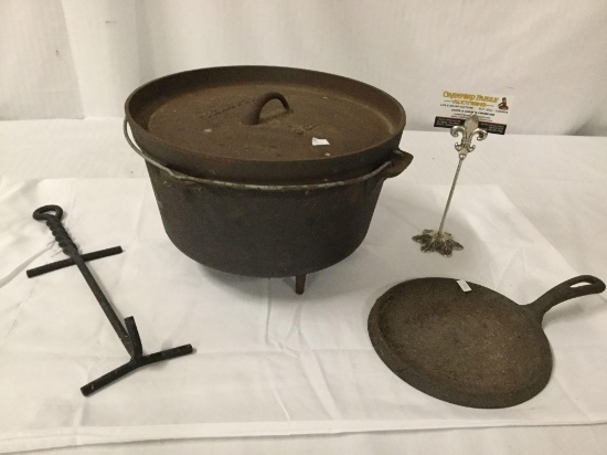 3 antique cast iron cooking items incl. griddle, texsport bean pot with lid and hook/holder
