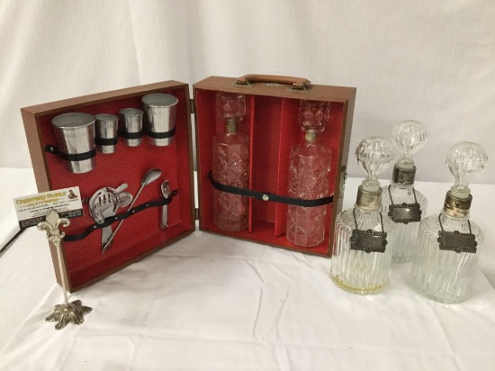 3 vintage decanters with metal chain tags and Imperial bartenders kit case for 2