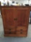 Large wooden mission style entertainment center with 4 drawers