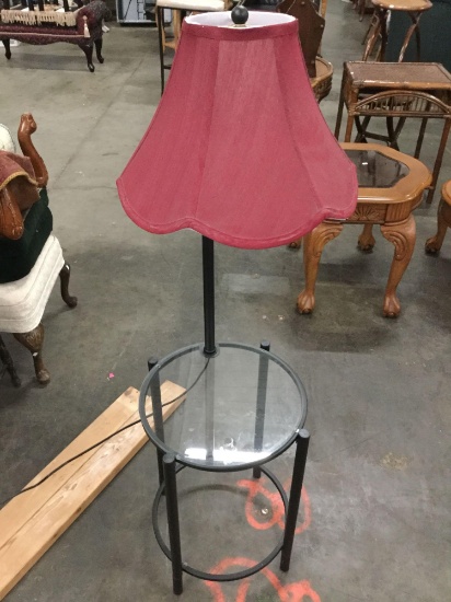 Lamp table with shade and glass surface, tested and working, approx 53 x 16 inches.