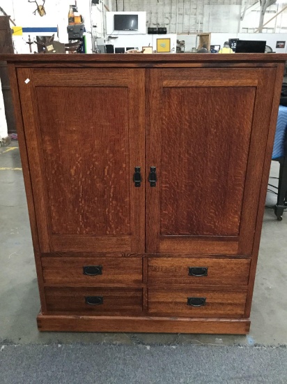 Large wooden mission style entertainment center with 4 drawers