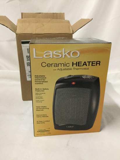 Lasso ceramic heater, unused in original box, approx 8 x 6 x 10 inches.