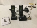 Pair of Motorola cordless home telephones with manual 4 x 9 inches