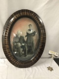 Vintage Oval shaped framed portrait of couple with domed glass , approx 19 x 25 inches.