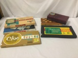 7 assorted board games. 2 Monopoly, 2 Scrabble, Chess, Checkers, and Clue. See pics