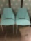 Pair of modern, geometric metal bucket chairs in light blue