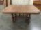 Antique wooden dining table on wheels - no leaves
