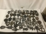 Massive collection of Victorian 1880s cast iron trivets & sad irons - various makers see desc