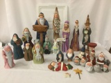 Large collection of painted wood holiday carvings, Santa Claus, Easter Bunny, wise men and wizard