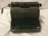 Vintage Remington Rand Typewriter, works. Includes dust jacket.