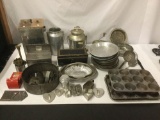 Large collection of assorted vintage Metal Kitchenware. Muffin Pans, Pie Pans, Cookie Cutters, Jars,