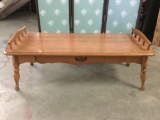 Long vintage maple coffee table with railed sides and a single drawer