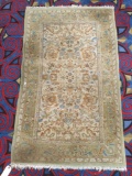 Small vintage wool carpet with fringe, unmarked, approx 36 x 61 inches.