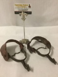 Pair of antique metal and leather spurs , horseback riding gear,