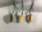 3 tooth shaped fossilized Baltic Amber pendants w/ cord necklaces