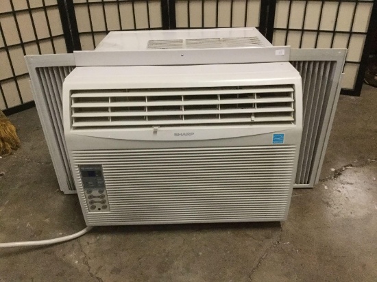 Sharp Window AC Unit with Remote. Has a dent, but tested, works