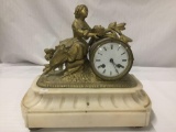 Antique figural brass clock with marble base - porcelain face and Victorian woman motif