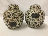 Pair of ceramic Asian ginger jars with lids and busy designs