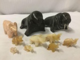 10 carved stone animals - 7 elephants, fox and 2 walrus
