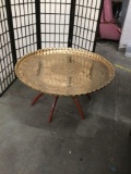 Vintage hammered and scalloped edge Chinese brass coffee table with mid century spider leg base