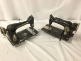 2 antique cast iron singer sewing machines, as is. One is marked AD459583