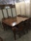 Modern tall antique inspired dining table set with 6 chairs and a leaf - one chair as is