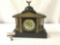 Antique unmarked metal shelf clock with stone look, gold detail and eagle topper