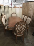 Large modern carved dining room table with 8 upholstered chairs and 2 leaves - antique style