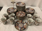 48 pieces of vintage Asian design dishes and mugs, made in Japan, largest 8 inches.