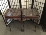 Pair of antique mahogany claw foot end table with glass top, thin legs and carved rail sides