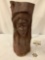 Wood carved log w/ female face, painted brown - shows some wear