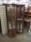 2 tall geometric display cabinet with lighted tops and glass shelves