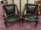 2 matching antique French (early 1900s) hand carved empire chairs w/ mahogany frame & leather seats