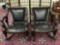 2 matching antique French (early 1900s) hand carved empire chairs w/ mahogany frame & leather seats