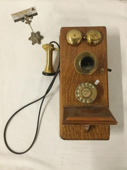 Antique wood and brass wall mounting hand crank telephone, approximately 10 x 13 x 20 inches